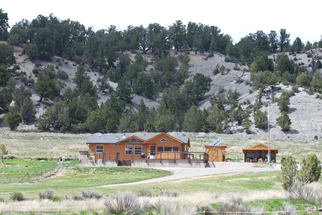 1225 County Road 226 Rifle, CO 81650 - Photo 18 of 22 an aerial view of a house with garden