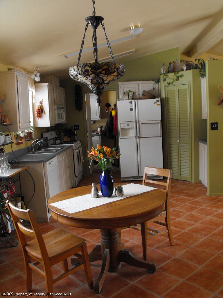 1225 County Road 226 Rifle, CO 81650 - Photo 5 of 22 a view of a dining room with furniture