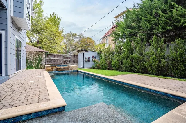 a view of a swimming pool with a patio