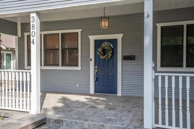 a front view of a house with a door and a window