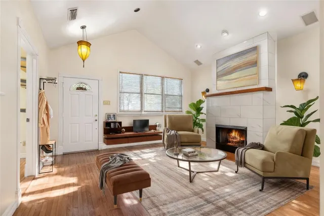 a living room with furniture and a fireplace