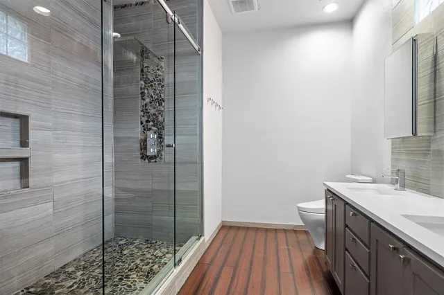 a bathroom with a sink and a shower