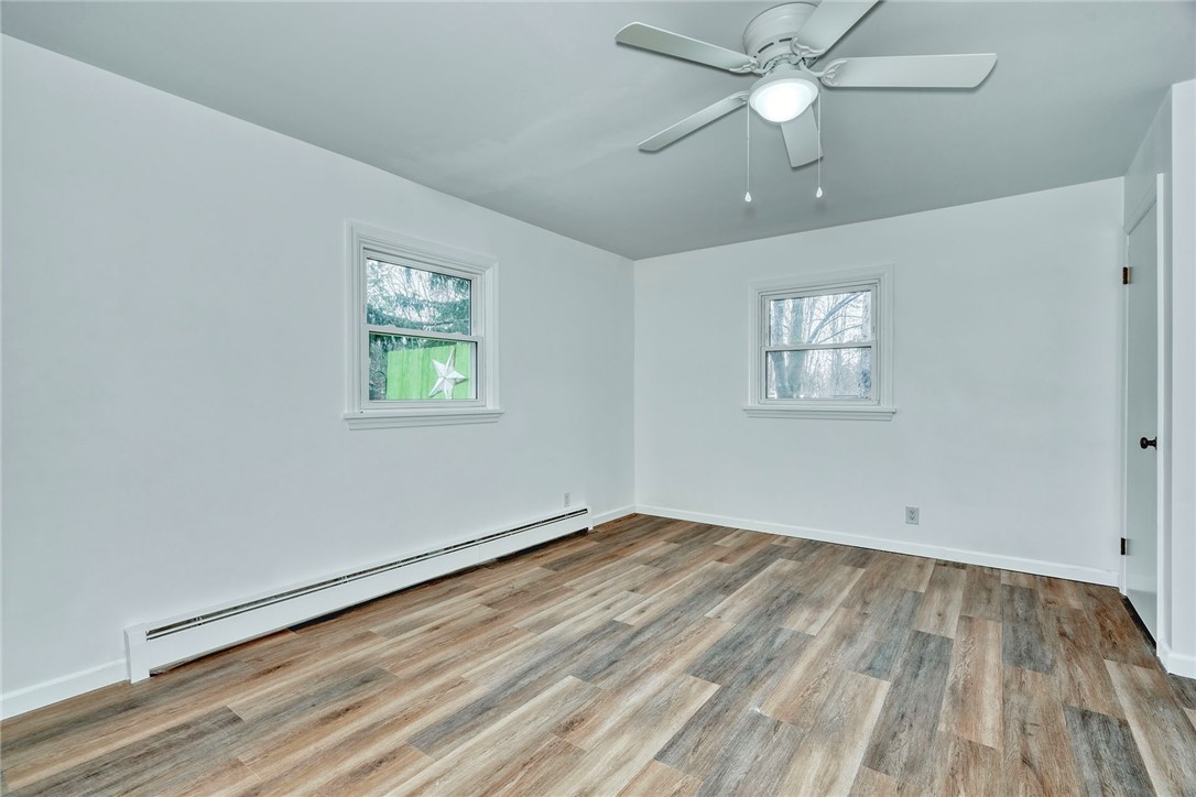 147 Basket Road Webster, NY 14580 - Photo 20 of 49 1ST FLOOR BEDROOM #1 W/NEW LUXURY FLOORING! COULD