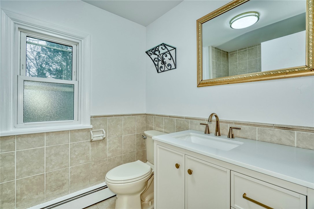 147 Basket Road Webster, NY 14580 - Photo 31 of 49 MODERN 2ND FLOOR BATH W/WHPOOL TUB, TILE FLR, NEW
