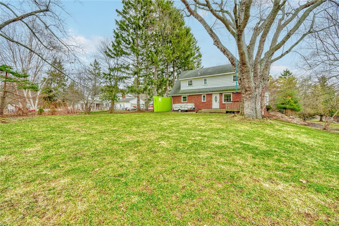 147 Basket Road Webster, NY 14580 - Photo 44 of 49 BACKYARD VIEW OF REAR EXTERIOR