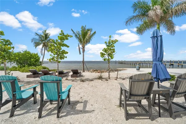 a swimming pool with outdoor seating and yard