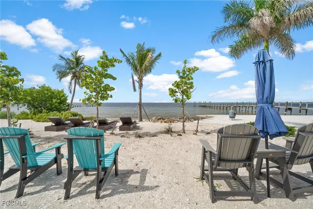 a swimming pool with outdoor seating and yard