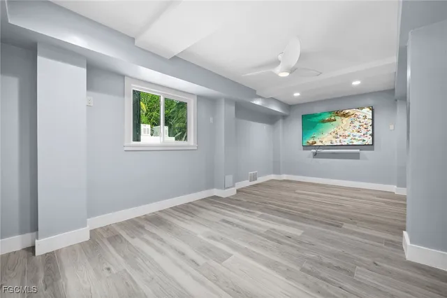a bathroom with a granite countertop toilet sink and a mirror