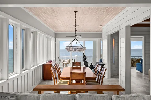 a living room with furniture and view of kitchen