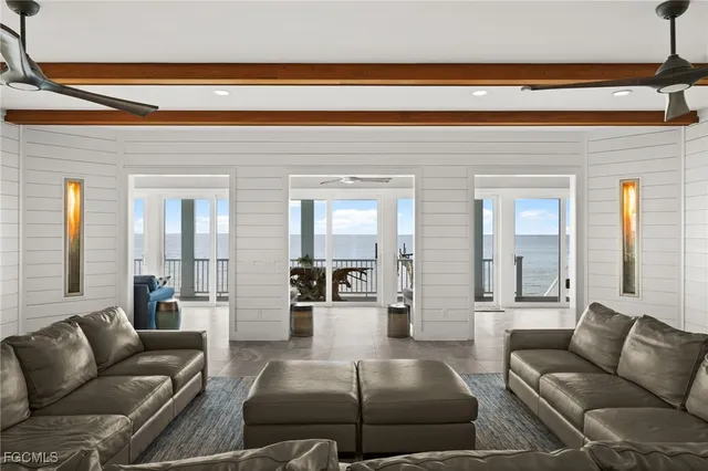 a large white kitchen with lots of counter space and appliances