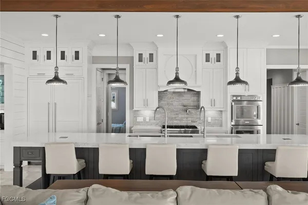 a view of a kitchen with furniture and windows