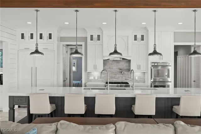 a view of a kitchen with furniture and windows