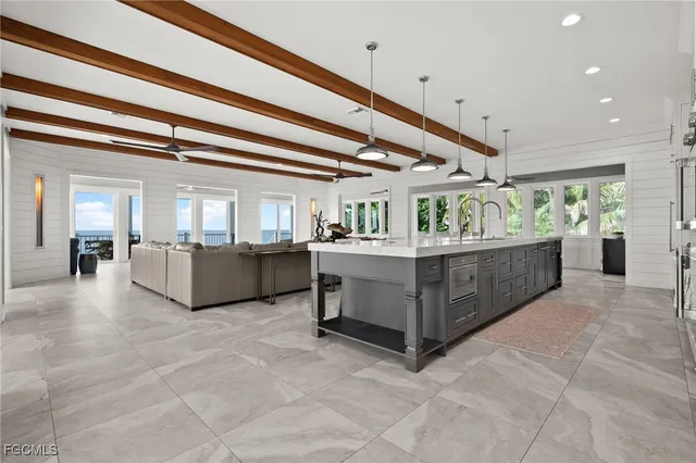 a living room with furniture a table and chairs