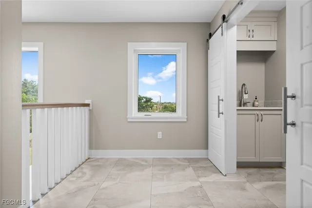 a view of a porch with furniture and garden