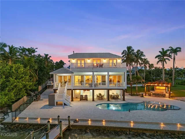 a view of a swimming pool and a yard