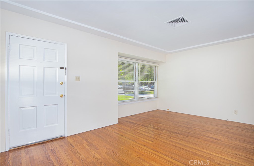 1562 Riverside Drive Glendale, CA 91201 - Photo 3 of 21 a view of empty room with wooden floor and fan