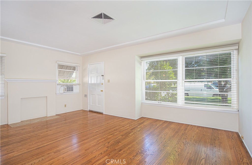 1562 Riverside Drive Glendale, CA 91201 - Photo 4 of 21 a view of empty room with wooden floor and fan