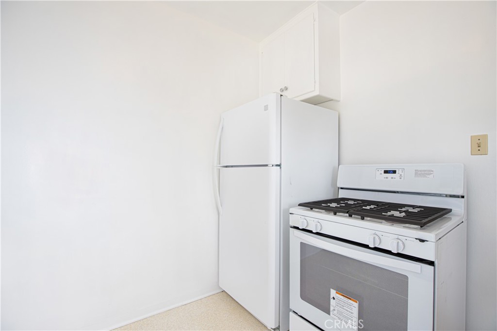 1562 Riverside Drive Glendale, CA 91201 - Photo 8 of 21 a white kitchen with granite countertop stainless steel appliances