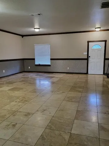 a view of a hall with an empty room