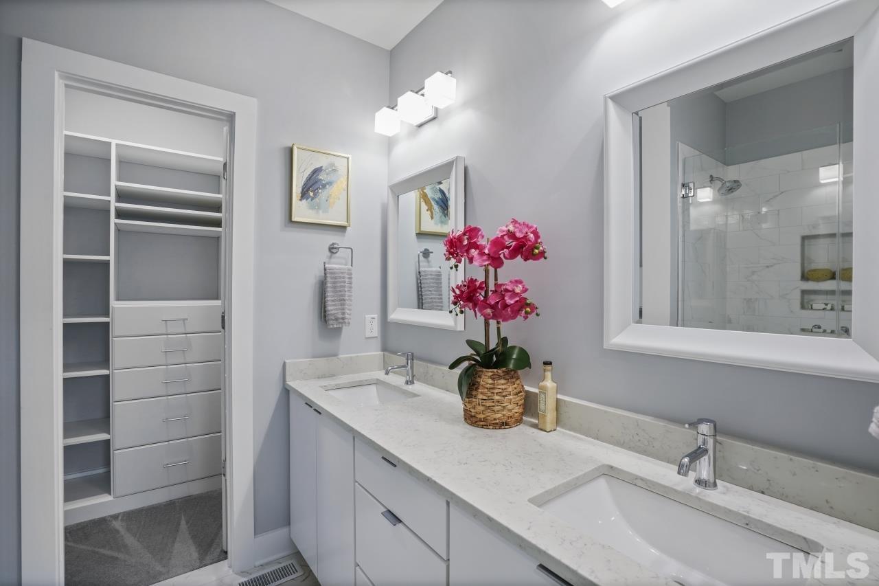 514 West South Street Raleigh, NC 27601 - Photo 24 of 41 a bathroom with a sink vanity and a mirror