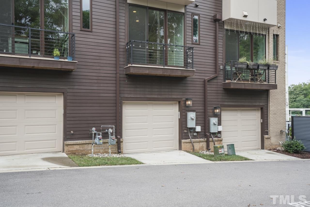 514 West South Street Raleigh, NC 27601 - Photo 39 of 41 a front view of a house with a yard and garage