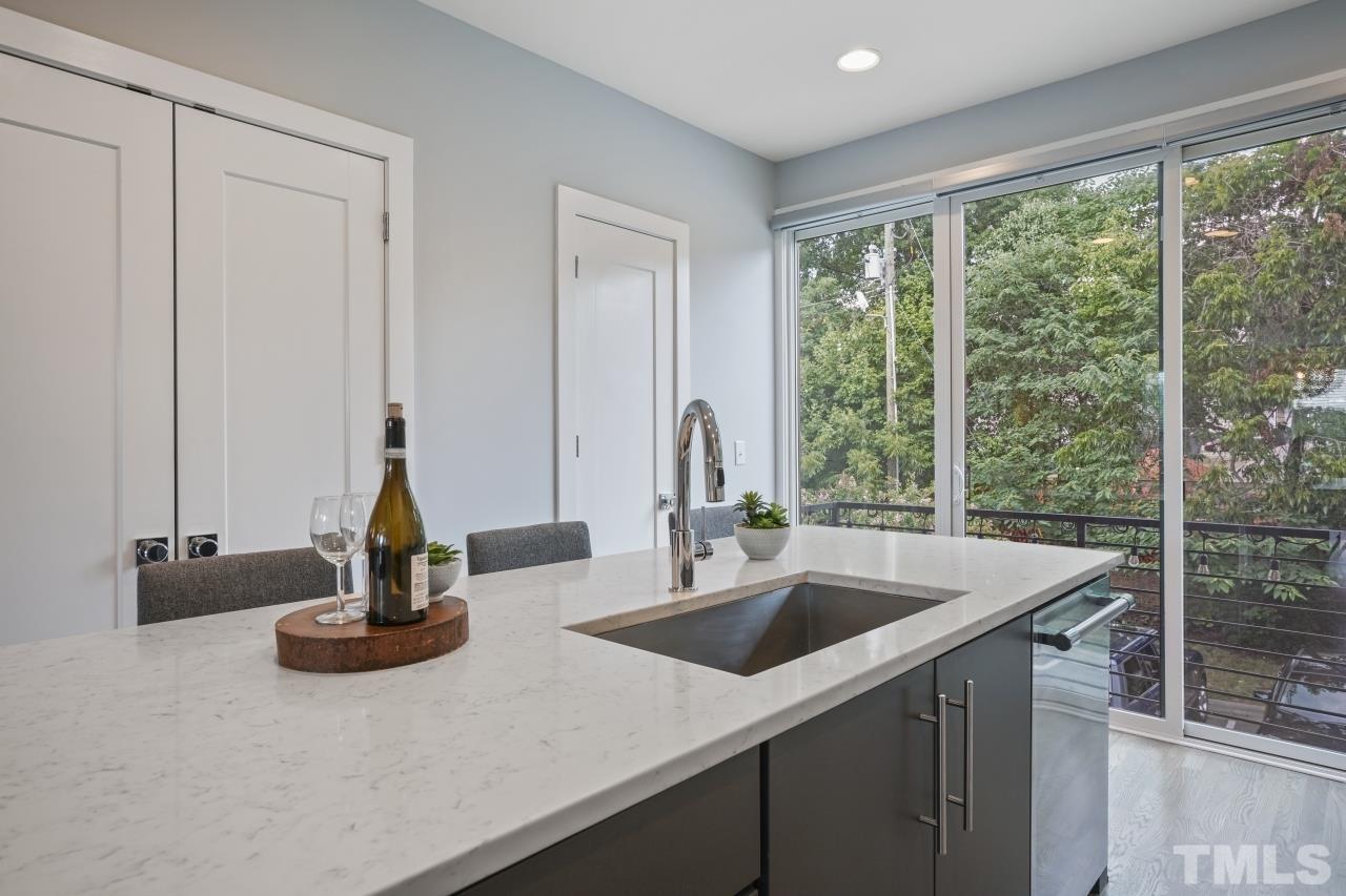 514 West South Street Raleigh, NC 27601 - Photo 10 of 41 a kitchen with a sink and a window
