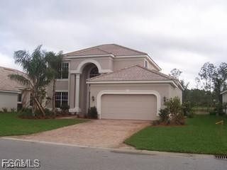 9053 Prosperity Way Fort Myers, FL 33913 - Photo 1 of 27 a front view of a house with a yard and garage