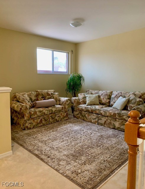 9053 Prosperity Way Fort Myers, FL 33913 - Photo 15 of 27 a living room with large couch and a rug
