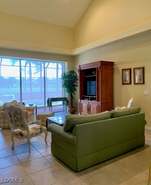 9053 Prosperity Way Fort Myers, FL 33913 - Photo 4 of 27 a living room with furniture and a flat screen tv