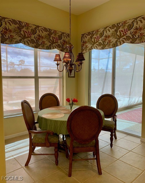 9053 Prosperity Way Fort Myers, FL 33913 - Photo 9 of 27 a view of a dining room with furniture and wooden floor