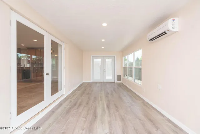 a view of an empty room and window