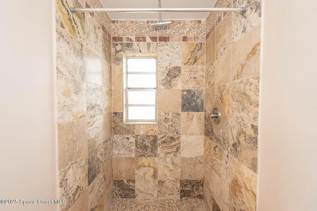a bathroom with a shower curtain