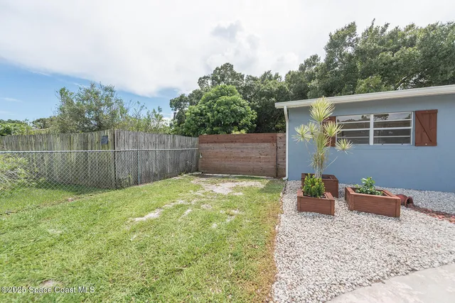a backyard of a house with lots of green space