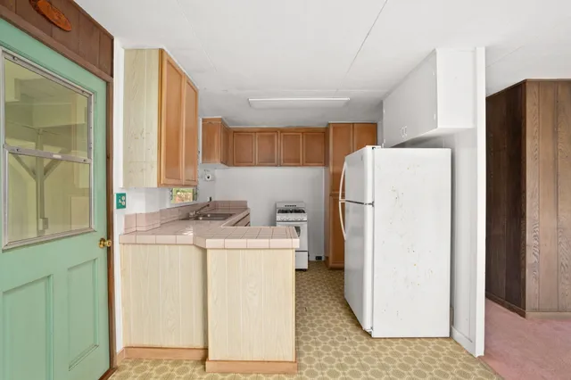 a utility room with sink washer and dryer