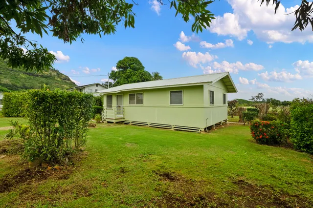 a view of a backyard with a garden