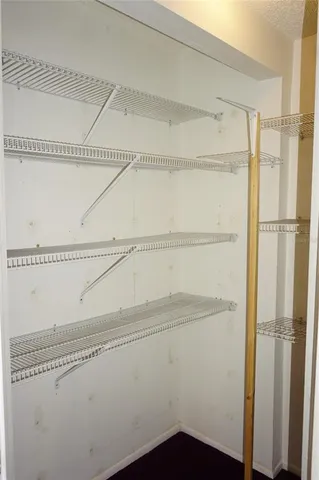 a view of a room with racks on the wall