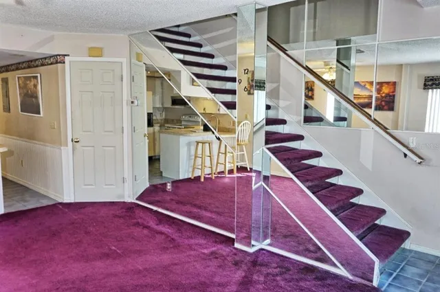a view of entryway bedroom and hall with wooden floor