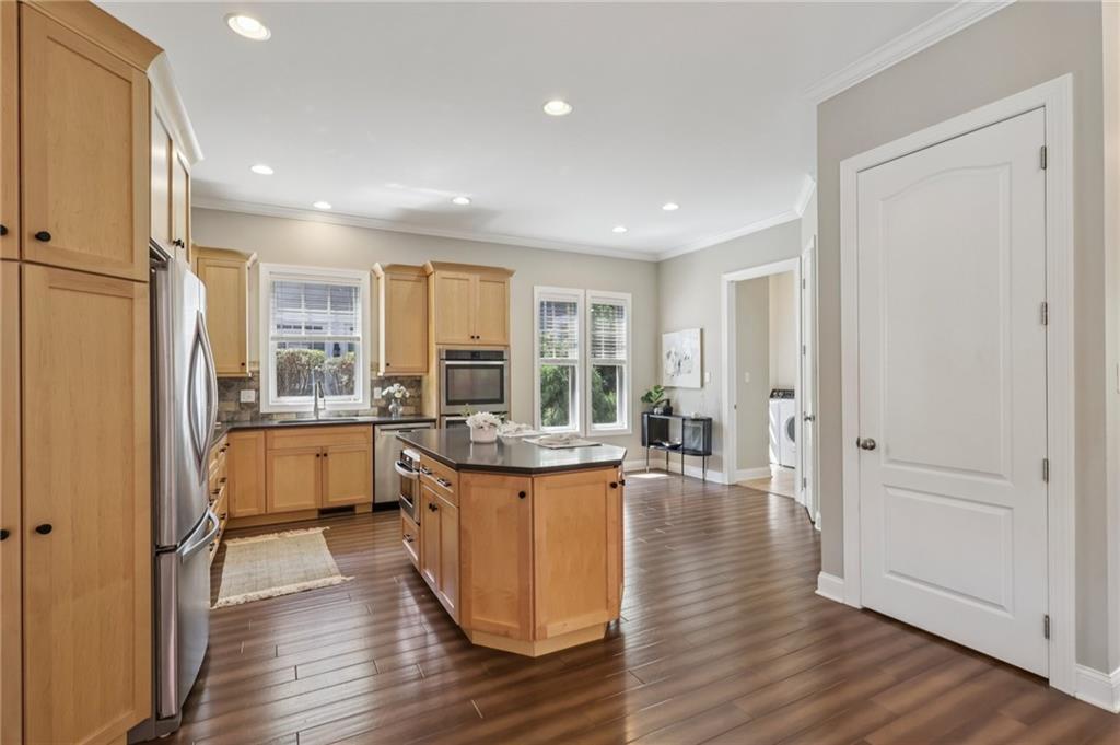 403 Cayuga Circle Mars, PA 16046 - Photo 20 of 50 a kitchen with stainless steel appliances granite countertop a refrigerator a sink dishwasher and a stove with wooden floor