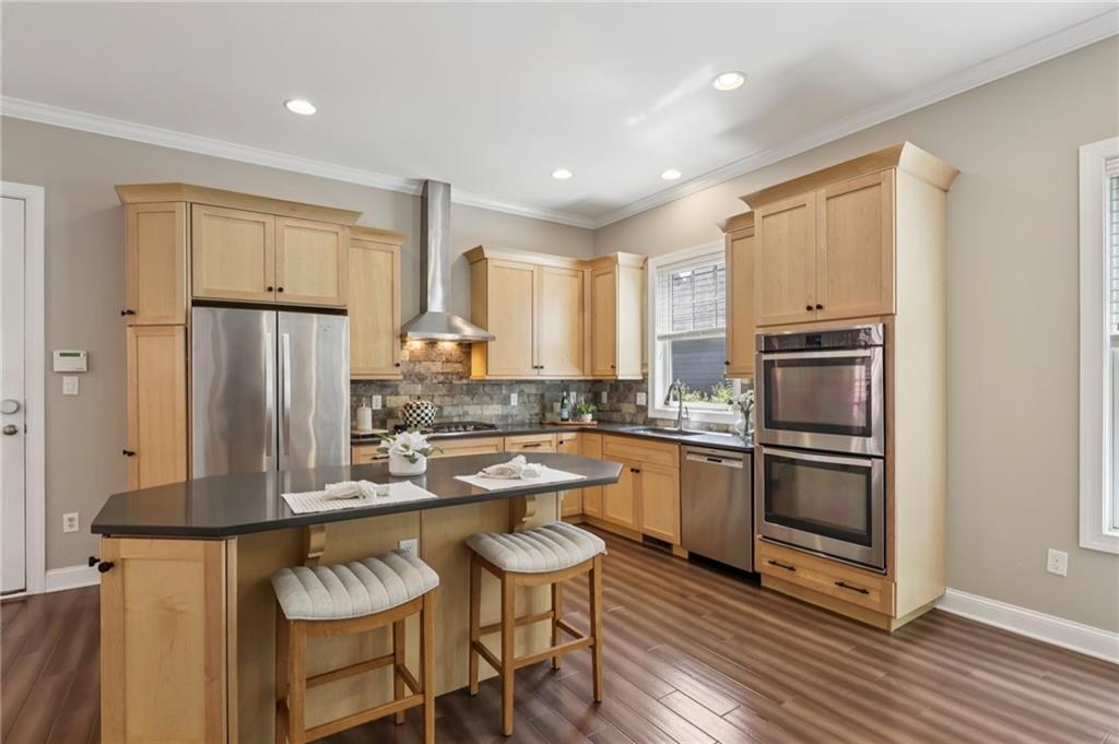 403 Cayuga Circle Mars, PA 16046 - Photo 21 of 50 a kitchen with granite countertop stainless steel appliances a stove a sink refrigerator and microwave
