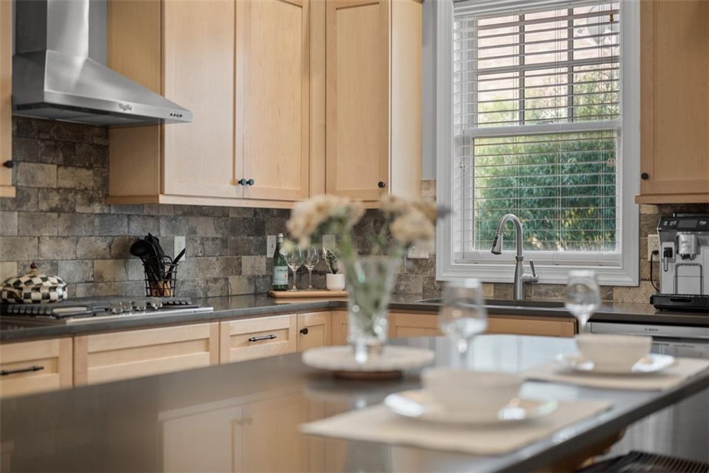 403 Cayuga Circle Mars, PA 16046 - Photo 23 of 50 a kitchen with granite countertop a sink and a white wooden cabinets