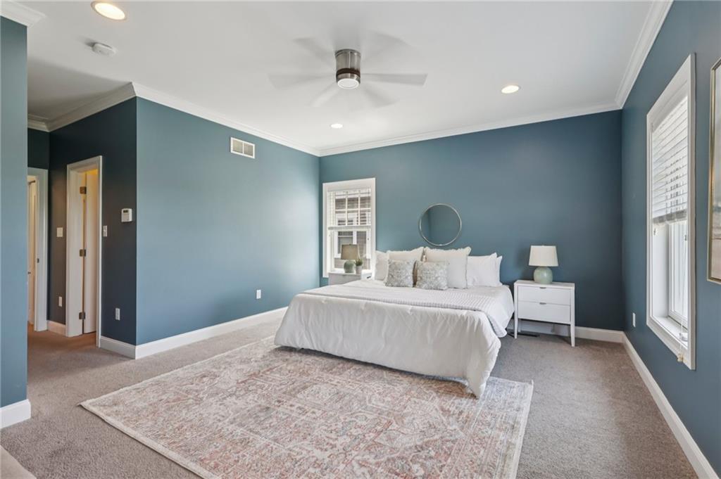 403 Cayuga Circle Mars, PA 16046 - Photo 27 of 50 a spacious bedroom with a large bed and a chandelier