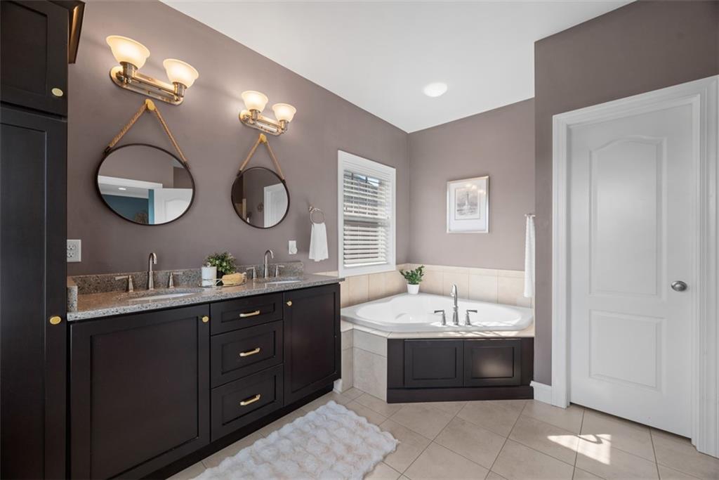 403 Cayuga Circle Mars, PA 16046 - Photo 30 of 50 a spacious bathroom with a tub double sink and a mirror