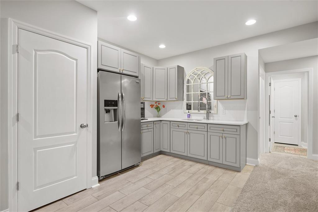 403 Cayuga Circle Mars, PA 16046 - Photo 43 of 50 a kitchen with kitchen island white cabinets and refrigerator