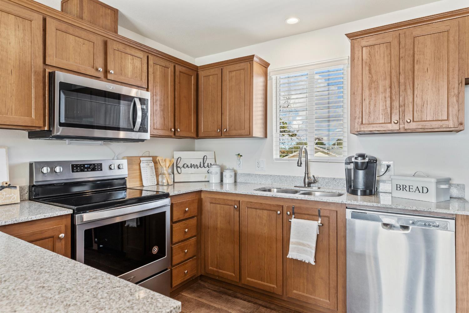 16120 Jacksonville Road Jamestown, CA 95327 - Photo 15 of 30 a kitchen with stainless steel appliances granite countertop a stove microwave and sink