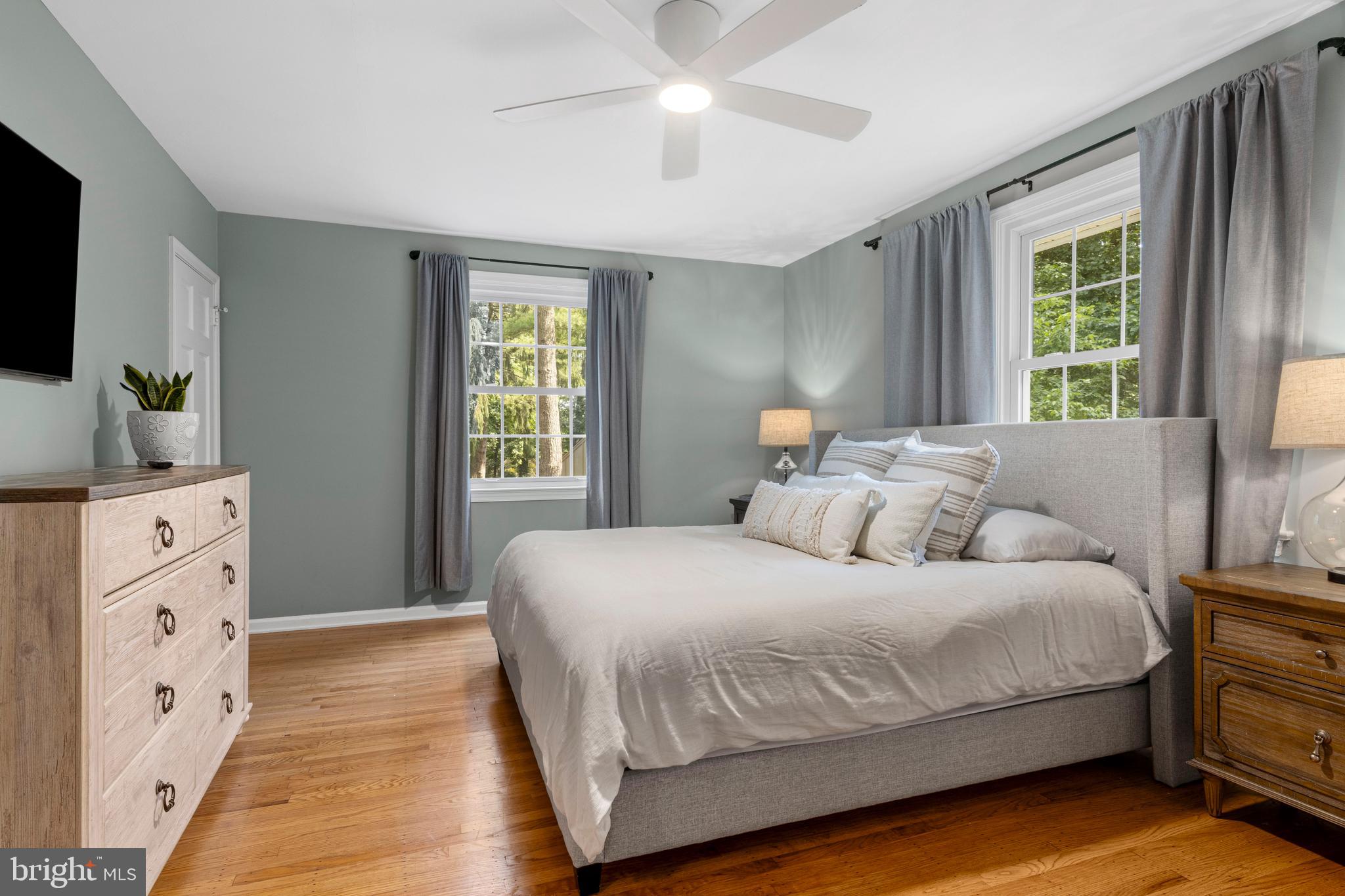 13 Weirwood Road Wayne, PA 19087 - Photo 34 of 61 a bedroom with a large bed and a tv on the dresser