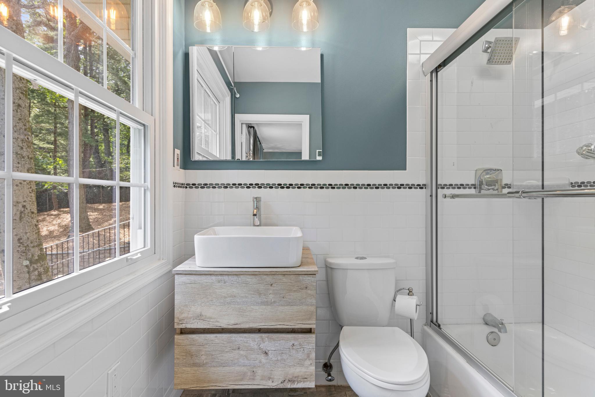 13 Weirwood Road Wayne, PA 19087 - Photo 36 of 61 a bathroom with a toilet a sink and a mirror