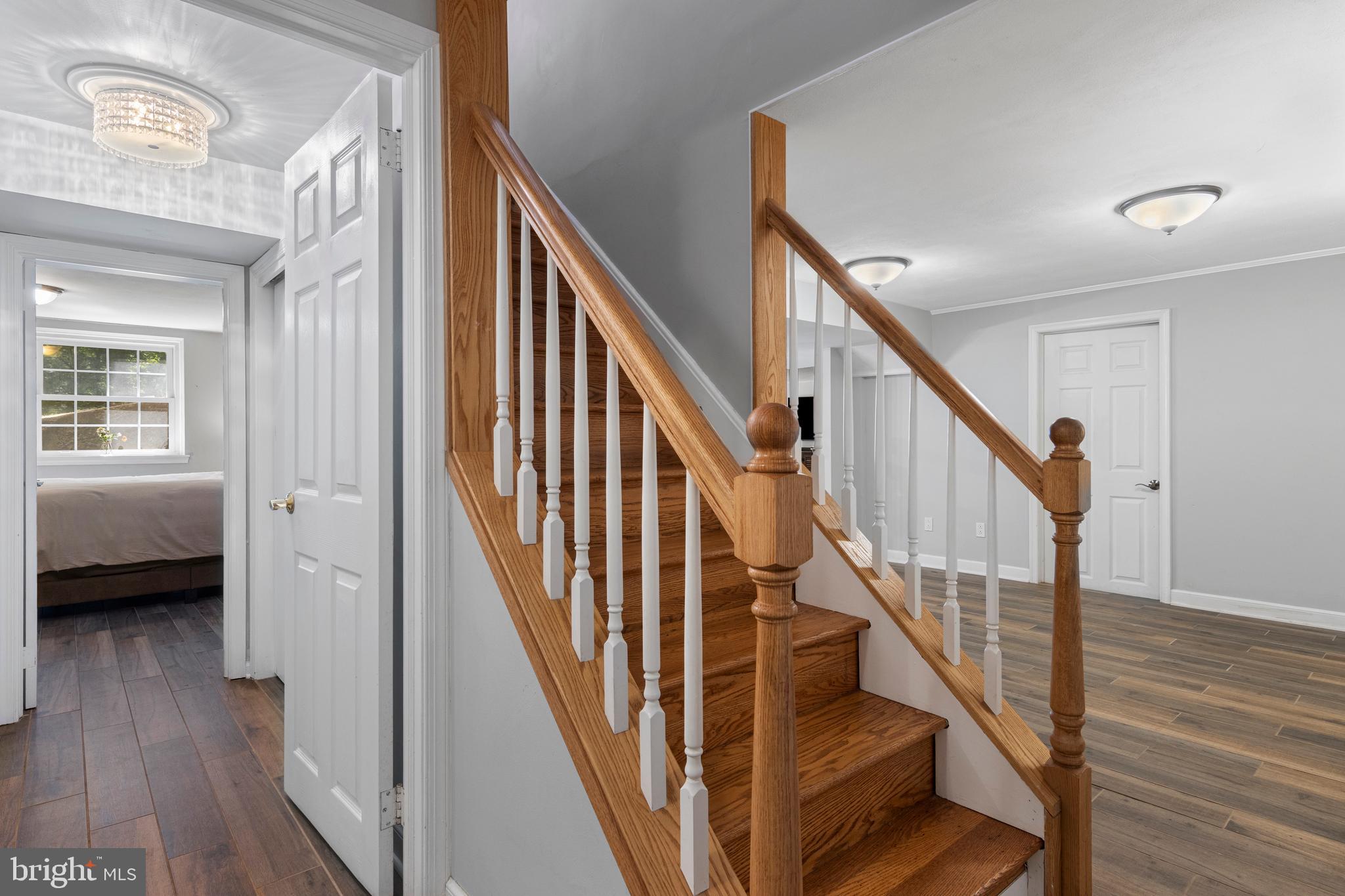 13 Weirwood Road Wayne, PA 19087 - Photo 46 of 61 a view of staircase with wooden floor and a front door
