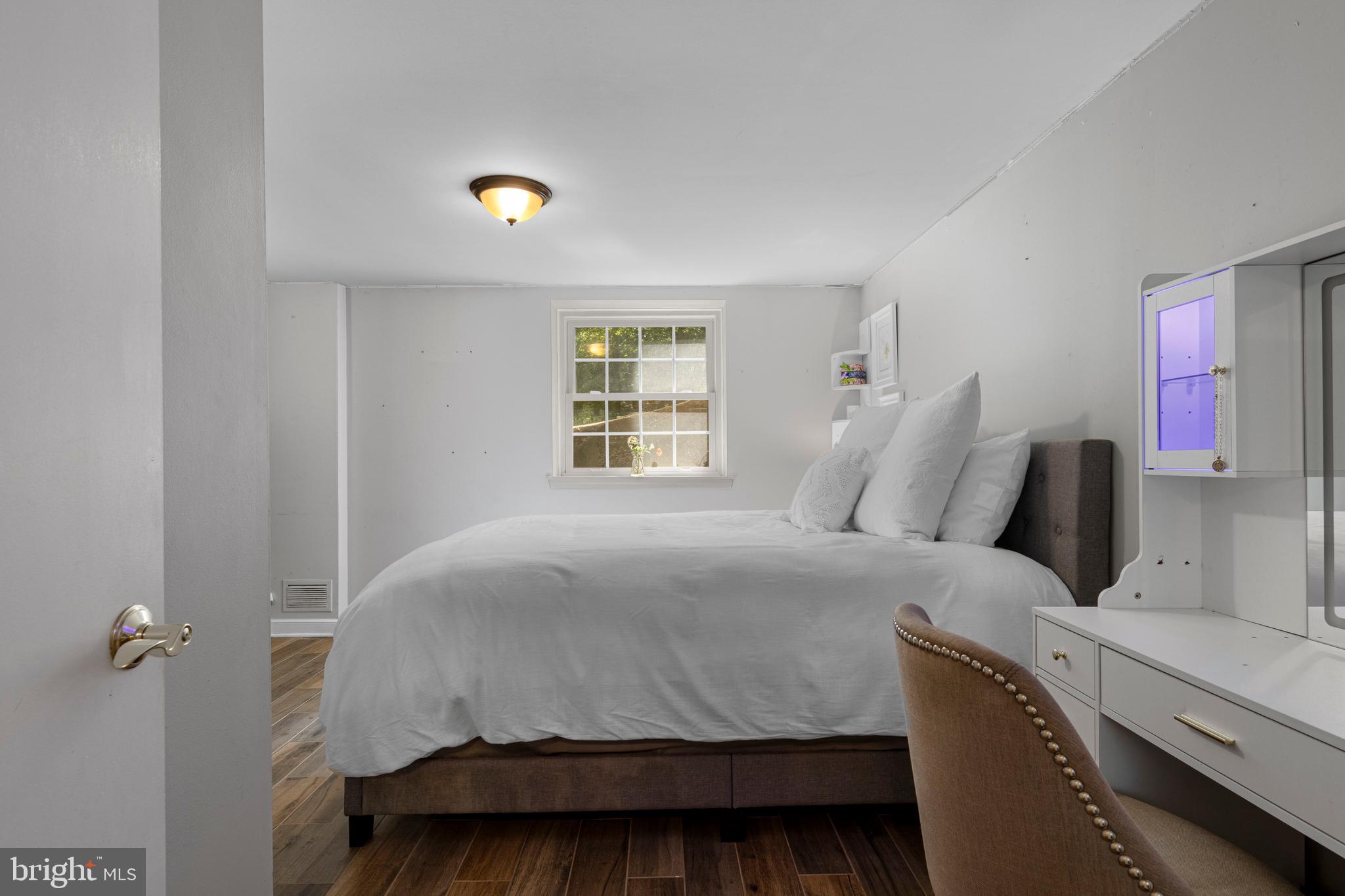 13 Weirwood Road Wayne, PA 19087 - Photo 48 of 61 a bedroom with a bed and window