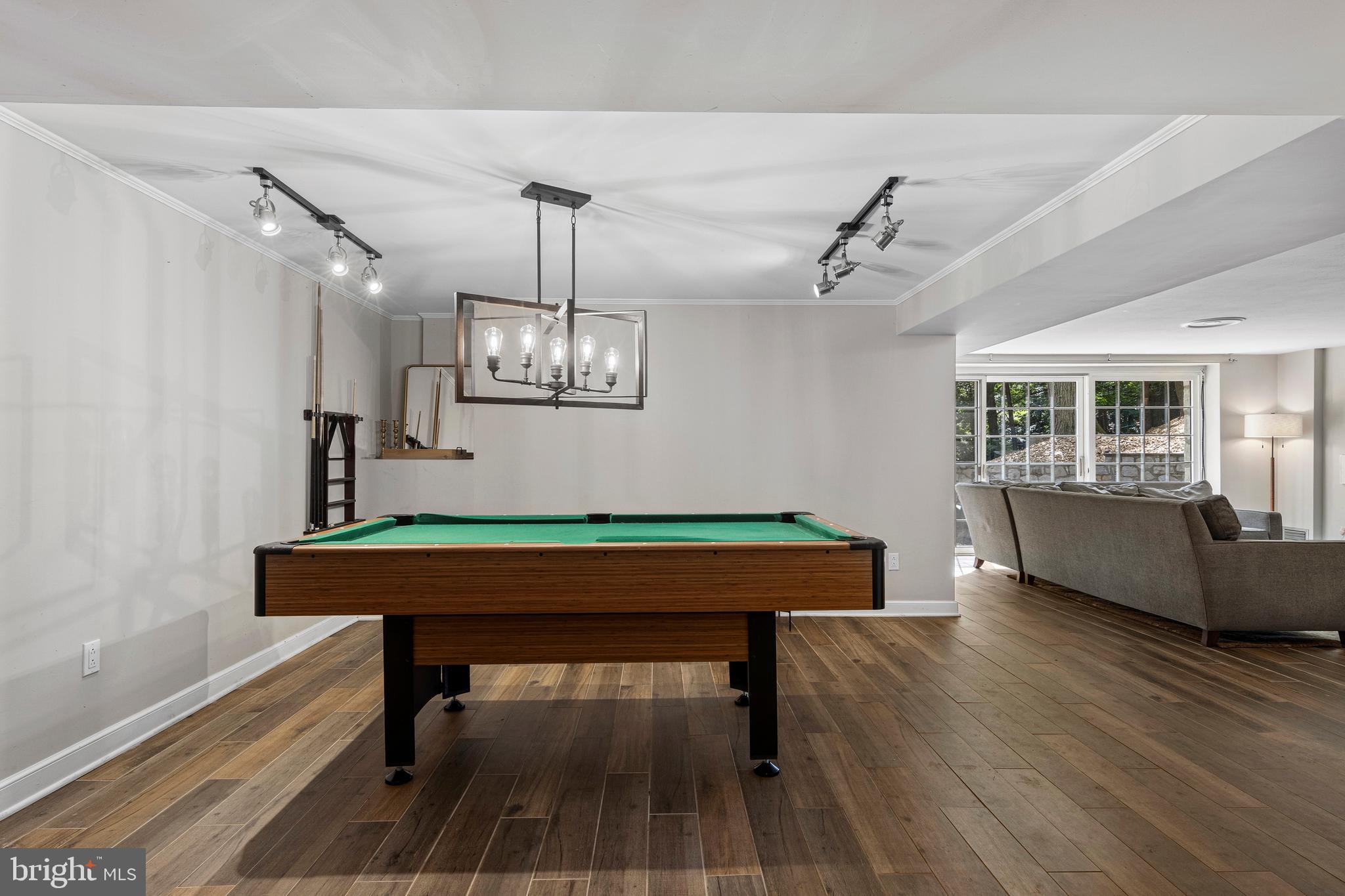 13 Weirwood Road Wayne, PA 19087 - Photo 50 of 61 a room with wooden floor pool table and windows