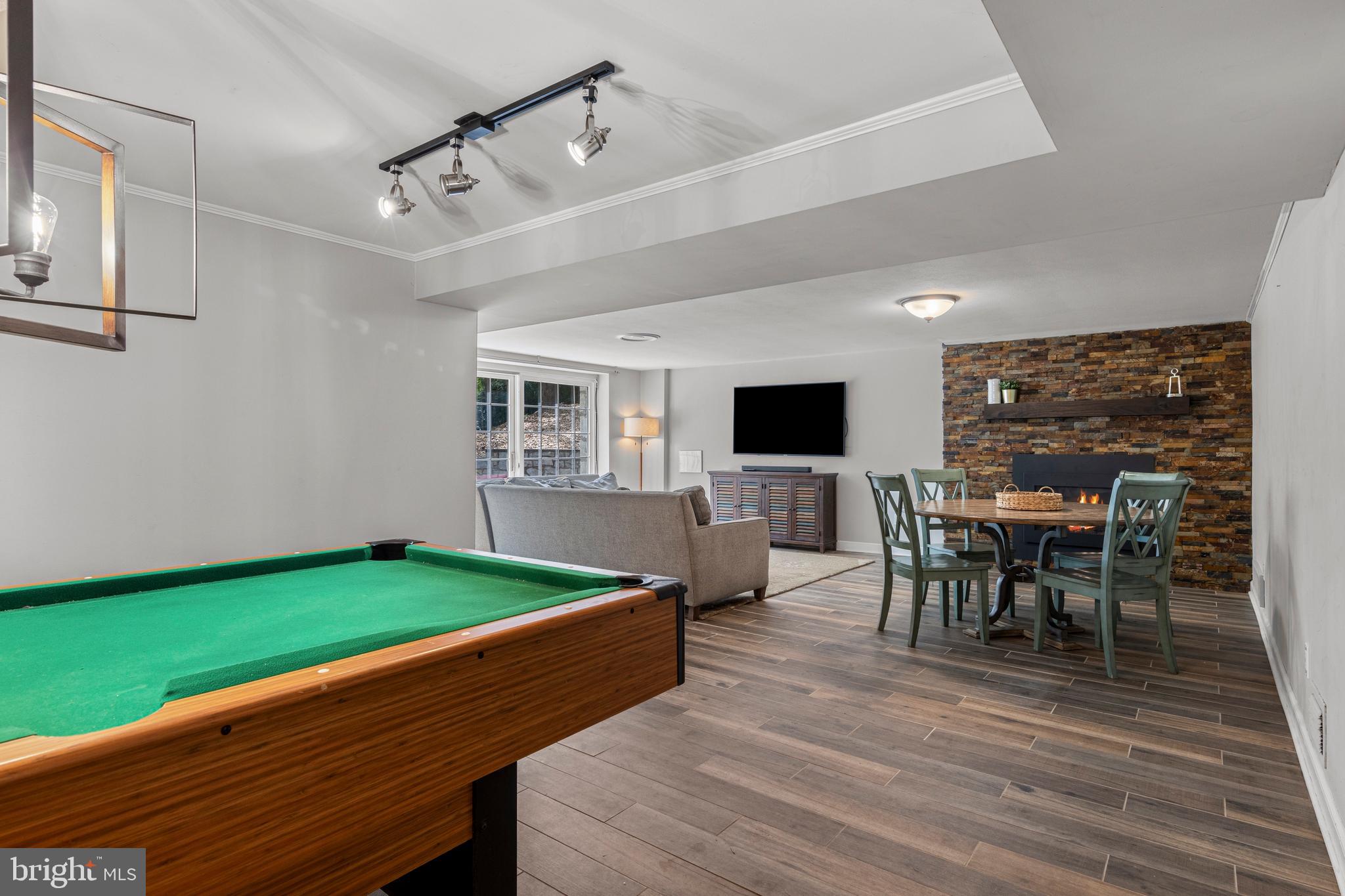 13 Weirwood Road Wayne, PA 19087 - Photo 51 of 61 a living room with dining room furniture and a wooden floor